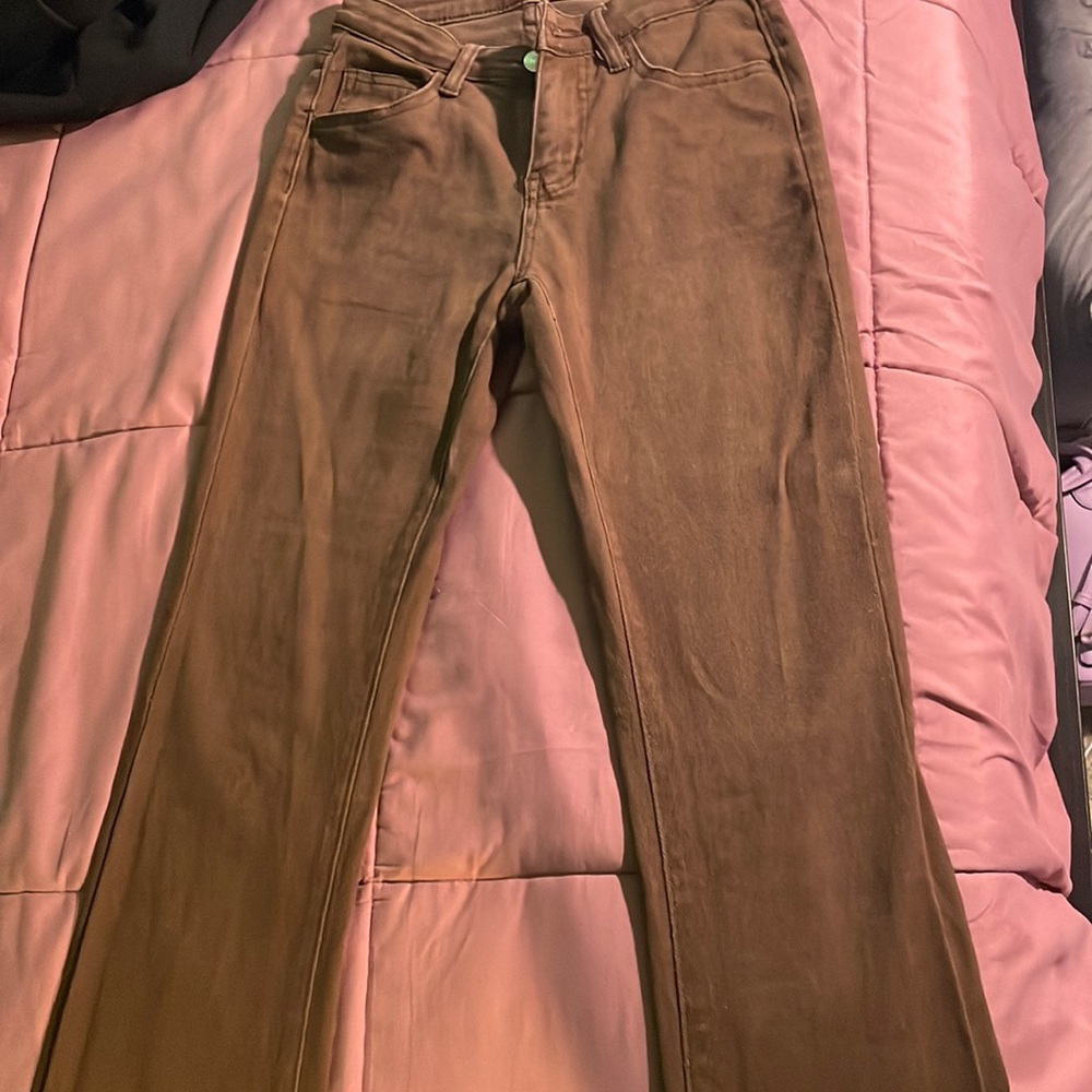 flare at the bottom brown jeans